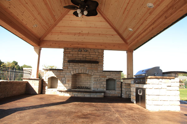Outdoor Fireplace under Cedar Structure